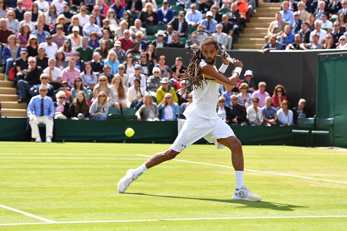 Dustin Brown serving against Nick Kyrgios on No.2 Court ...